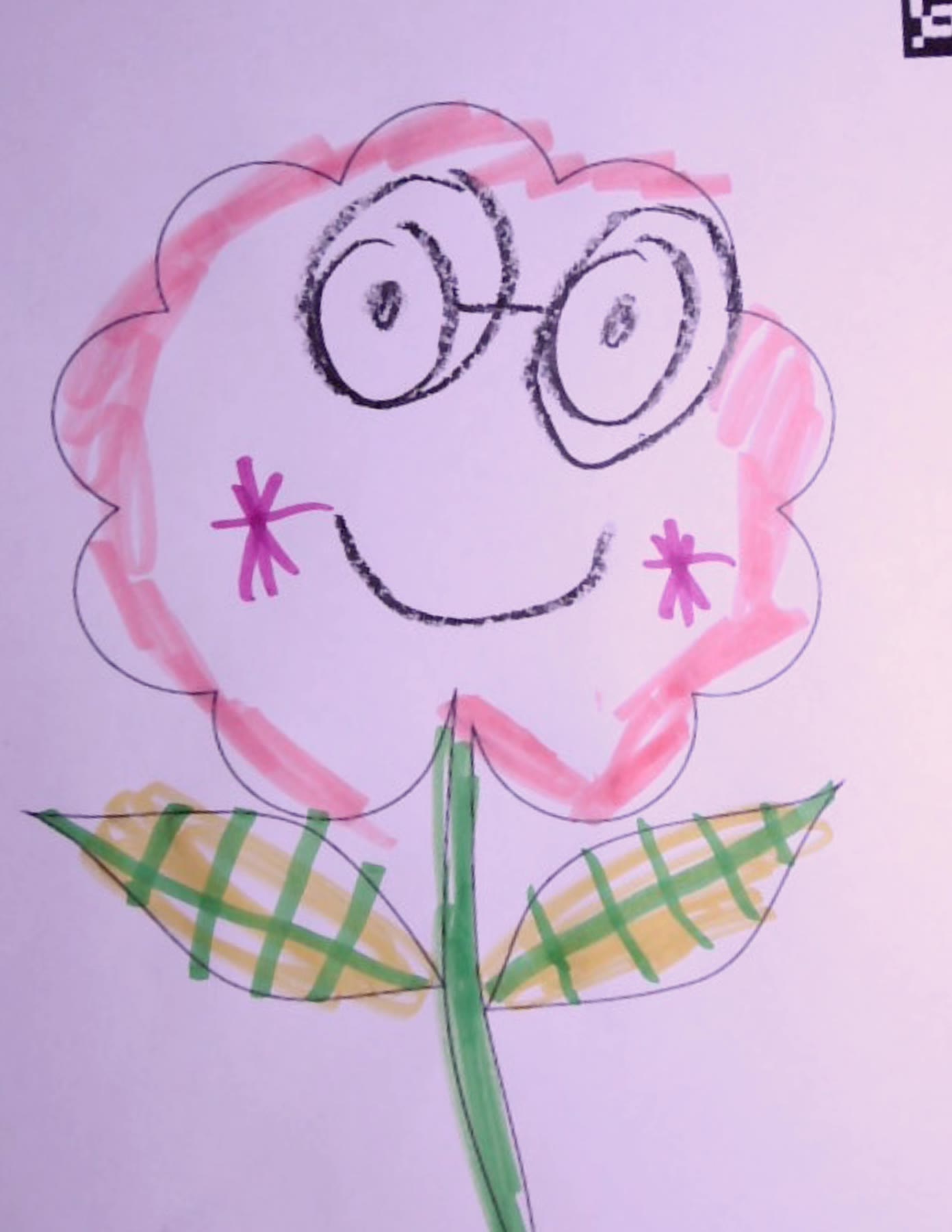 Scanned flower coloring page drawn as a smiling face with round glasses, pink petals, and green-and-yellow plaid leaves