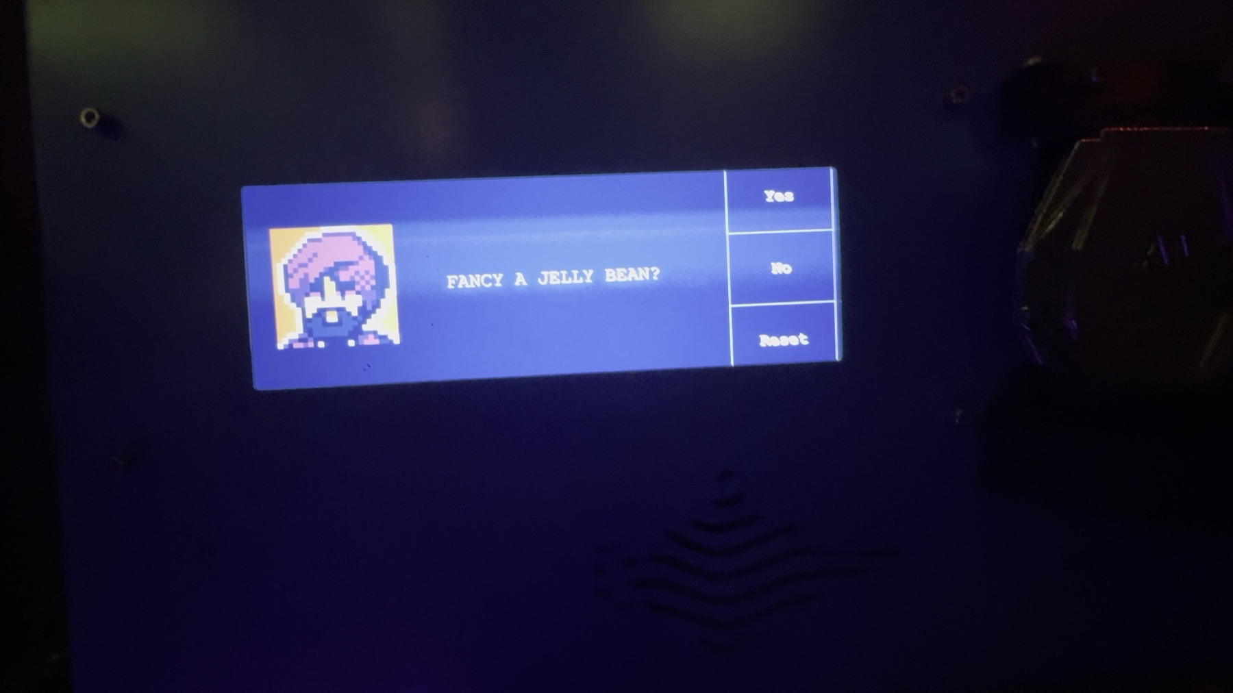 A screen showing a pixel-art character with purple hair and the text FANCY A JELLY BEAN? next to Yes / No / Reset buttons