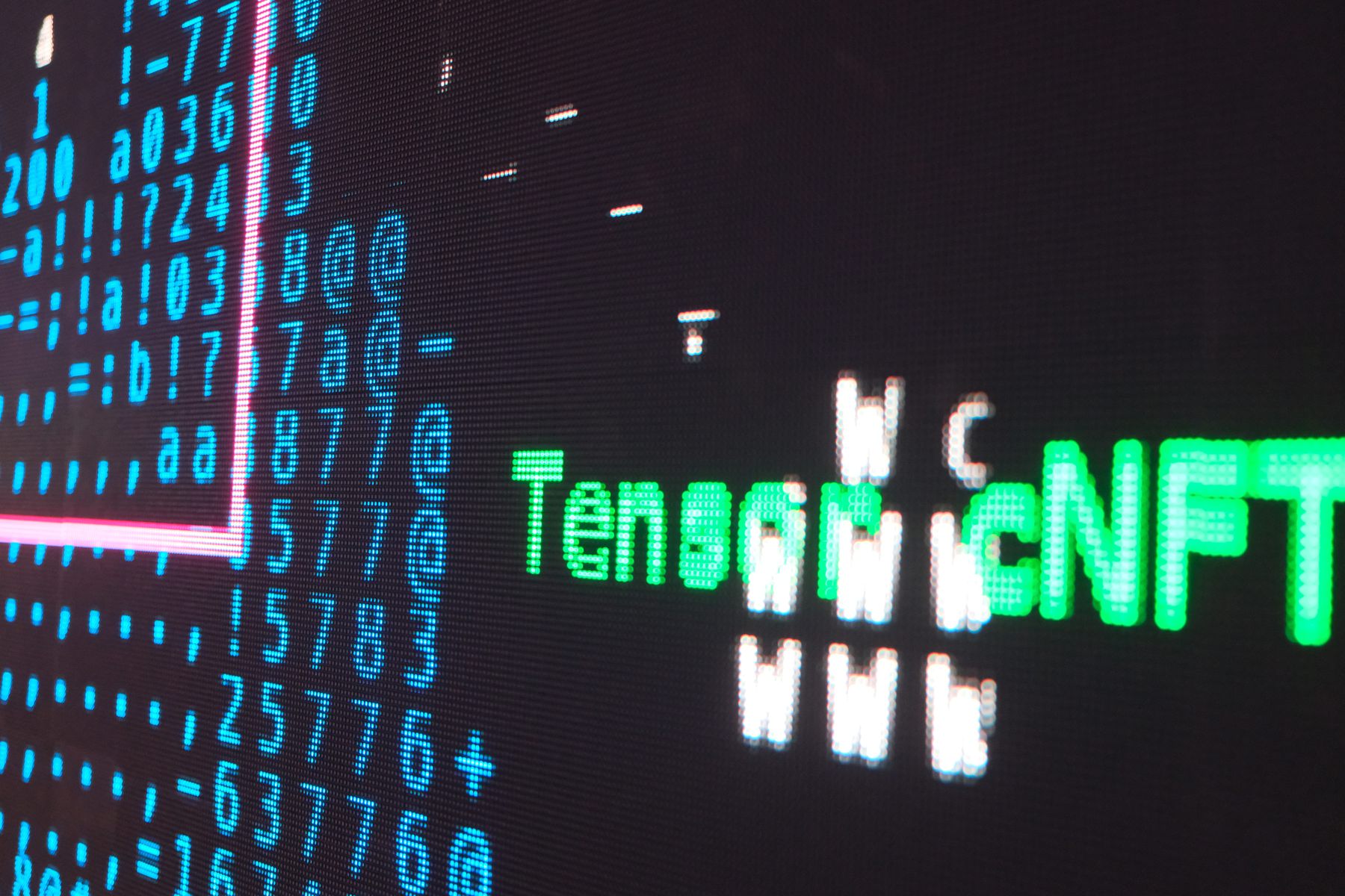 The wall showing a green-accented ASCII state naming an on-chain token