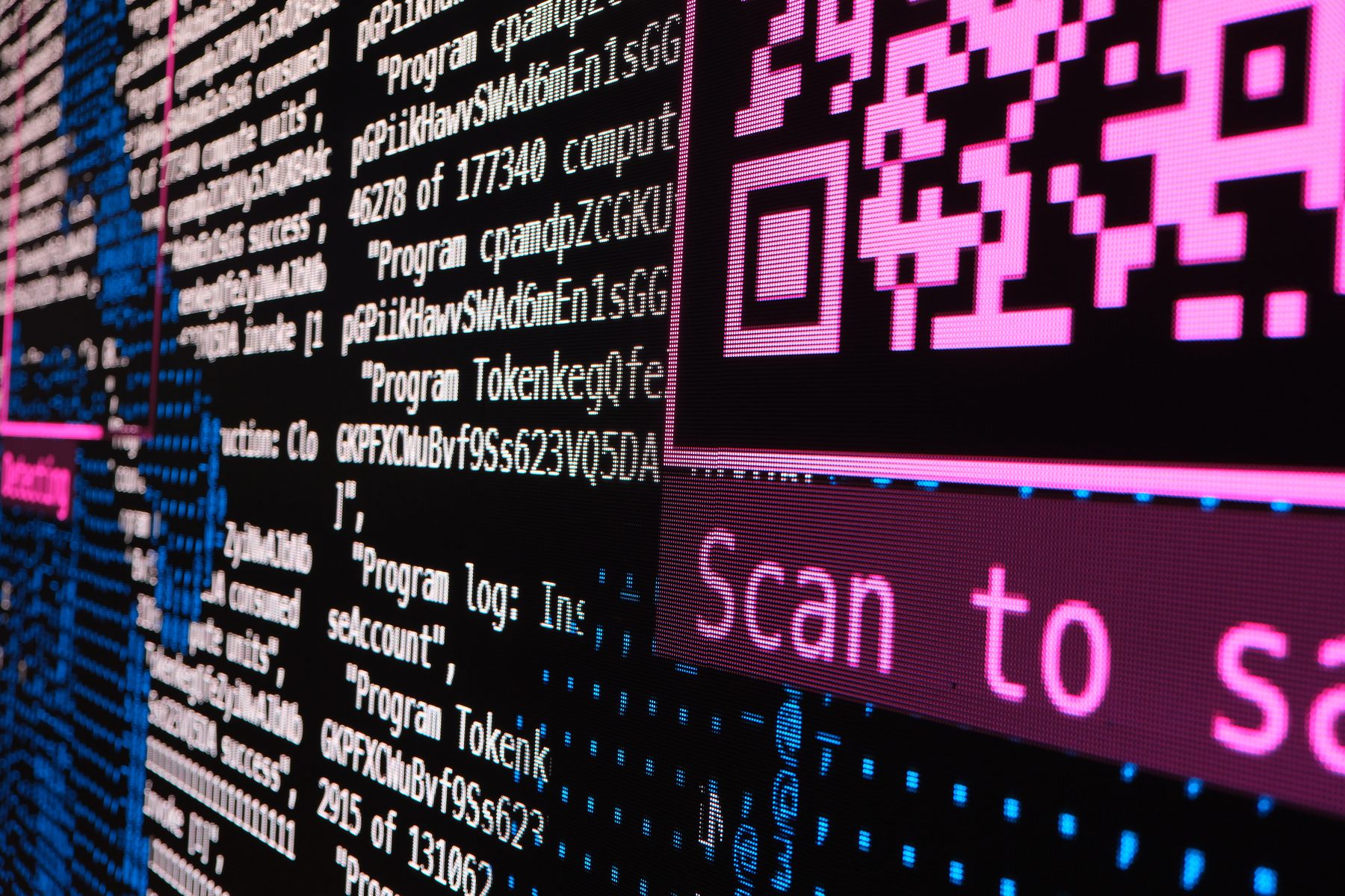 A generated QR code displayed large on the wall beside a scan-to-save prompt